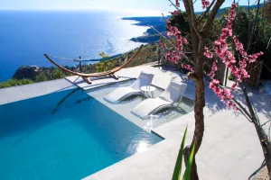 A newly renovated luxury villa overlooking the Mediterranean, fully equipped with modern amenities.