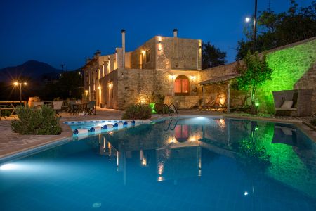 villa and pool at night